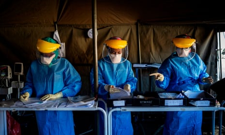 Health workers at screening and testing tents set up at the Charlotte Maxeke Hospital in Johannesburg.