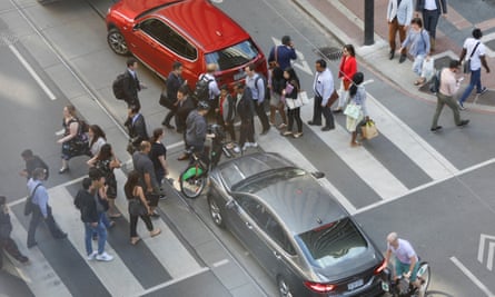 Pedestrians, cyclists and motorists navigate the complicated and confusing intersection of Bay Street and Richmond Street West in Toronto.