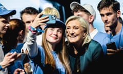 Marine Le Pen posing in a selfie with a female supporter.