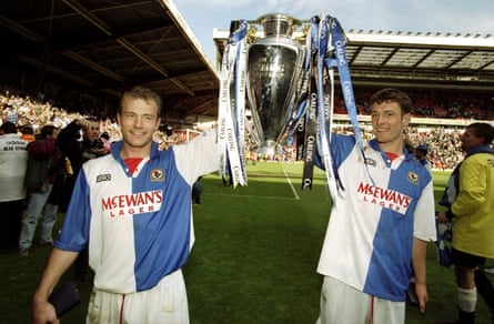 Alan Shearer and Chris Sutton celebrate with the Premier League trophy.