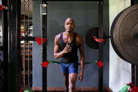 Luvo Manyonga stretches in the gym
