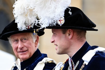 King Charles with his eldest son, Prince William, both wearing traditional hats with feathers