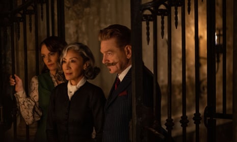 Tina Fey as Ariadne Oliver, Michelle Yeoh as Mrs Reynolds and Kenneth Branagh as Hercule Poirot in A Haunting in Venice.