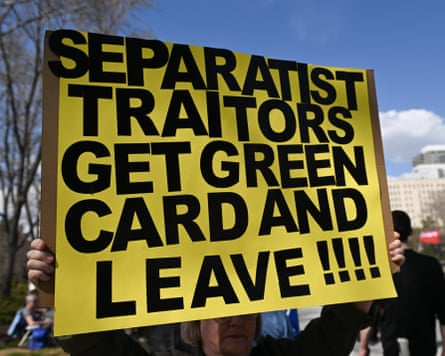 A participant hold a placard as hundreds gather for a ‘Resistance Rally’ at the Alberta Legislature in Edmonton, Alberta, Canada, on April 26, 2025.