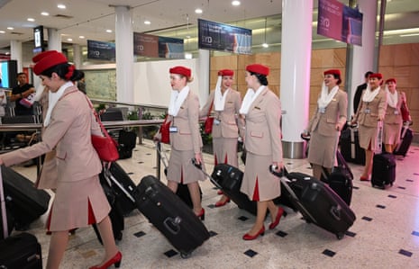 Cabin crew from Emirates walk through the arrivals hall at Sydney’s airport