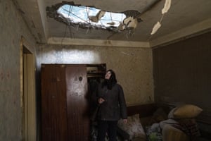Halyna Falko looks at the destruction caused after a Russian attack inside her house near Brovary, on the outskirts of Kyiv, Ukraine.