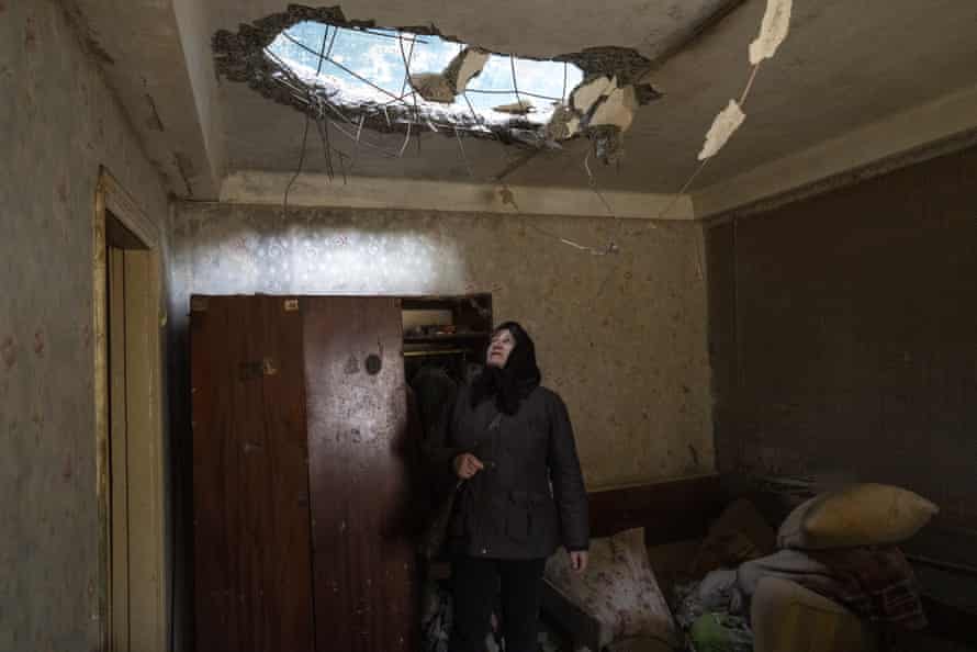Halyna Falko looks at the destruction caused after a Russian attack inside her house near Brovary, on the outskirts of Kyiv, Ukraine.