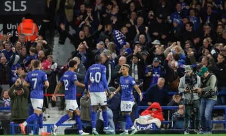 Omari Hutchinson (right) celebrates the equaliser.