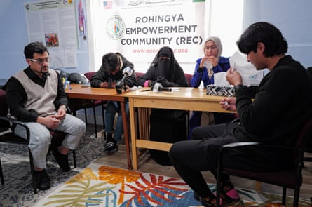 people cry as they sit at a table