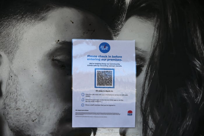 A QR code information form is seen placed on a closed door of a store on High Street in Penrith