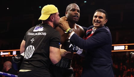 Daniel Dubois celebrates with his trainers after victory against Fabio Wardley.
