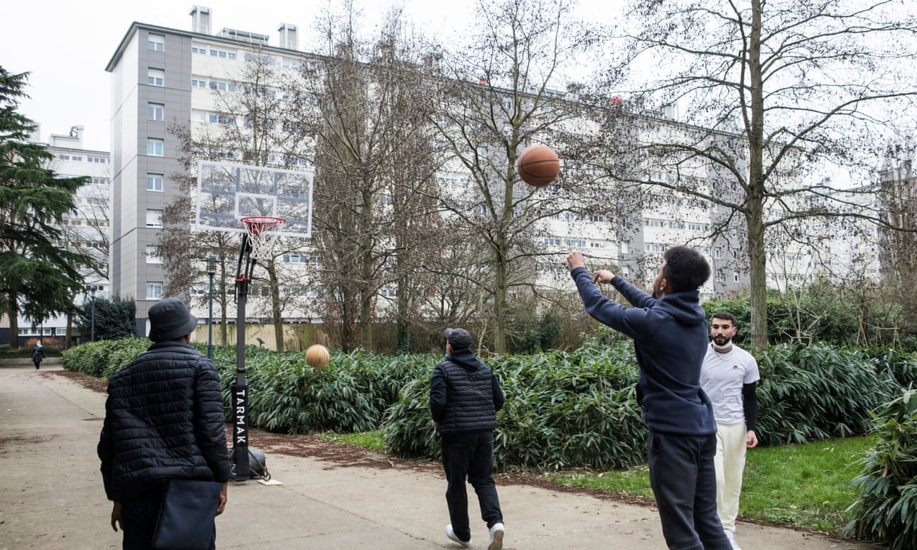 Young people from Maurepas, a working class district north of Rennes, play basketball.