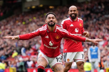 Manchester United’s Matheus Cunha celebrates after his goal is awarded following a lengthy VAR check for handball against Bryan Mbeumo