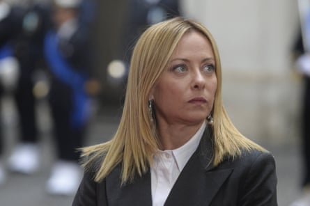 Giorgia Meloni looks off camera