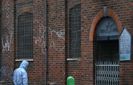 A forensics officer works at the scene