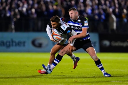 Henry Slade of Exeter Chiefs is tackled by Finn Russell of Bath