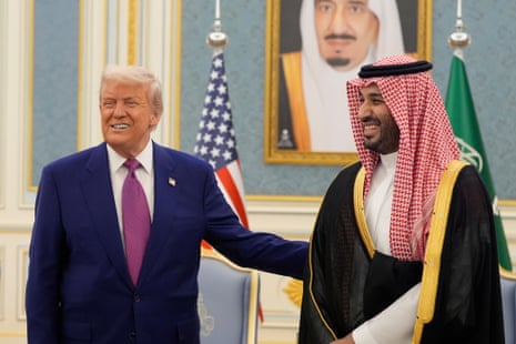 Trump and bin Salman smile as they pose for a picture at an official state meeting in Riyadh in May