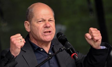 The German chancellor, Olaf  Scholz, speaks at a May Day union rally in Dusseldorf.