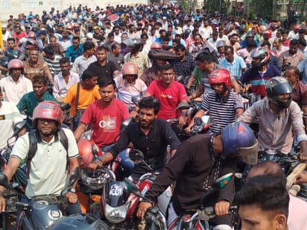 A crowd of motorcyclists wait for fuel at a petrol station in the Bogura district in Bangladesh.