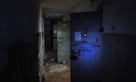Holding cells are visible in a basement of a police station that was used by Russian forces to detain and torture Ukrainians in the recently liberated town of Izium
