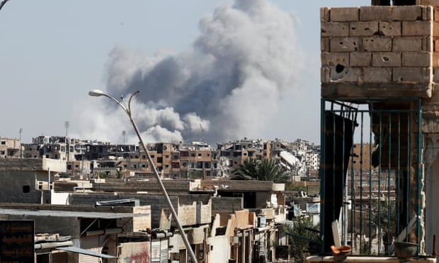 Smoke rises after a coalition air strike in Raqqa, Syria