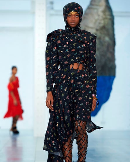 The Preen catwalk featured black silk floral tea dresses that were layered over cosy hoodies.