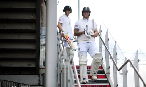 Ben Stokes and Harry Brook of England walk out to bat.