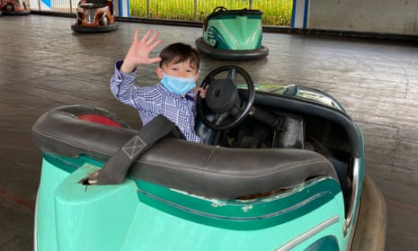 Six-year-old Percy Zamora enjoys a bumper car ride in Manila for the first time in more than a year.