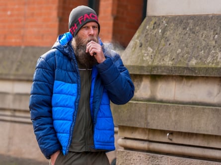 Sean Peers in a blue coat and beanie hat