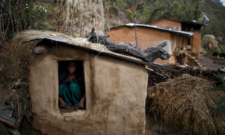 Uttara Saud sits inside a Chaupadi shed in the hills of Legudsen village in Achham District in western Nepal.