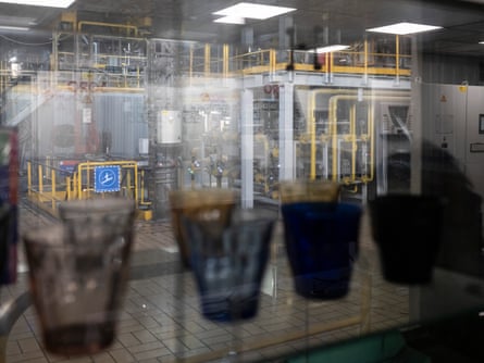 Glasses in front of window into factory.