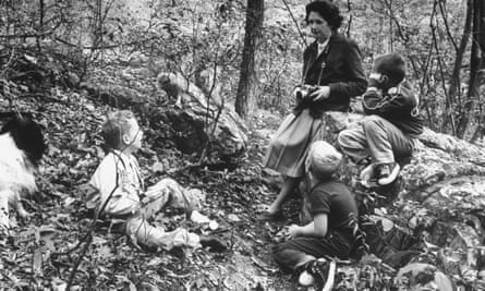 Rachel Carson with children and dog in woods near her home.