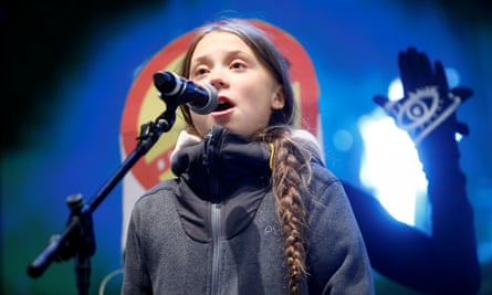 Climate change activist Greta Thunberg delivers a speech at a climate change protest march.
