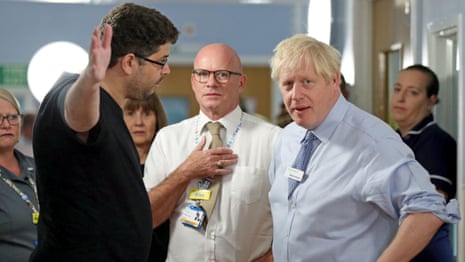 'There’s no press here?': father of hospital patient confronts Boris Johnson – video