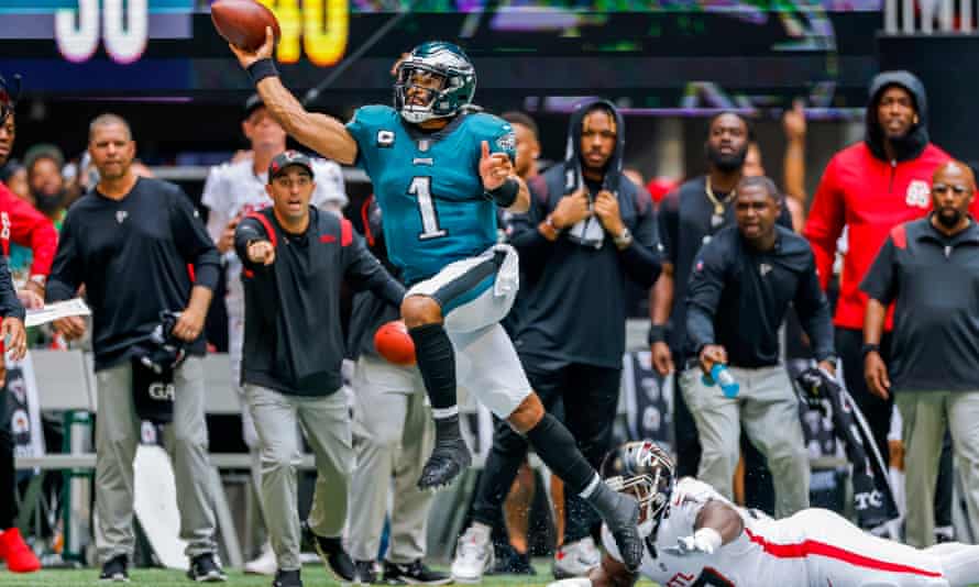 Jalen Hurts gets away from a tackle for the Eagles