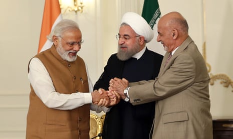 Narendra Modi (left) holds hands with the Iranian president, Hassan Rouhani (centre) and his Afghan counterpart, Ashraf Ghani, in Tehran.
