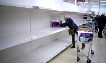A shopper gets the last pack of toilet rolls at a supermarket in Northwich on 19 March 2020.