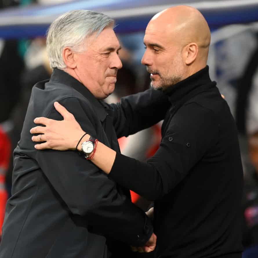 Mancheter City manager Pep Guardiola shakes hands with his Real Madrid counterpart Carlo Ancelotti ahead of kick-off.