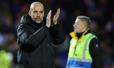Pep Guardiola applauds the fans after his Manchester City side beat Peterborough in the FA Cup.