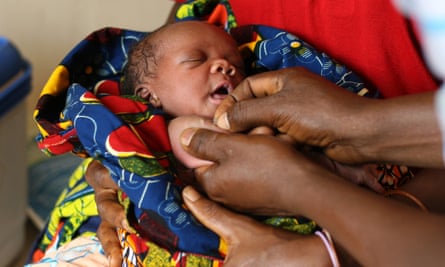 A baby is vaccinated in Africa.