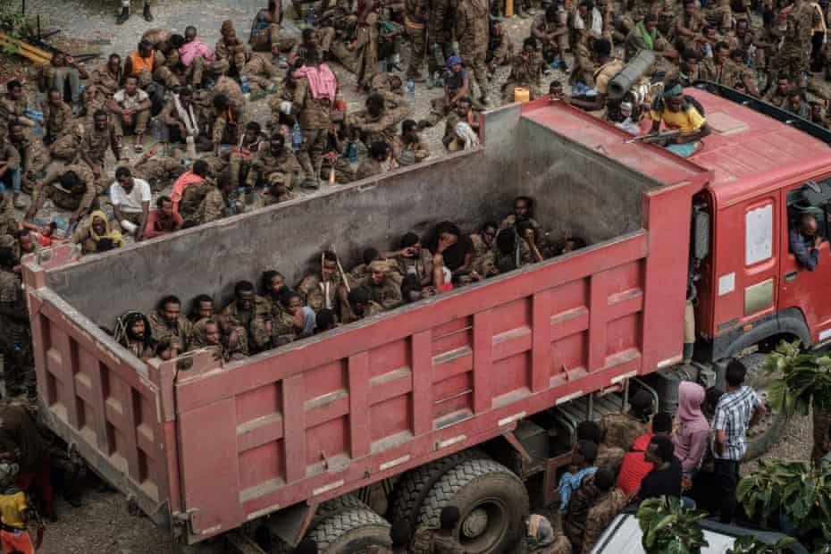Wounded captive Ethiopian soldiers arrive on a truck at the Mekele Rehabilitation Center in Mekele, the capital of Tigray region, Ethiopia, on 2 July 2021.