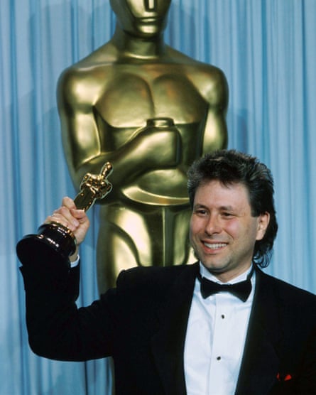 Alan Menken at the 1990 Academy Awards, holding his Oscar for best original score in The Little Mermaid
