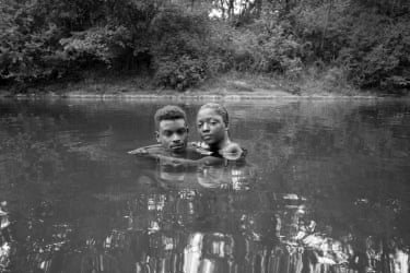 A couple seen submerged to their shoulders in the watering hole