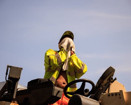 A construction worker struggling in the heat.