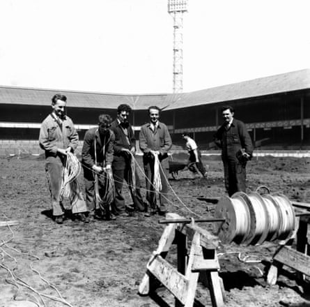 A team of MANWEB electricians laying out the special cable at Goodison Park which will help reduce frost, frozen pitches and the need to cancel matches due to bad weather in May 1958.