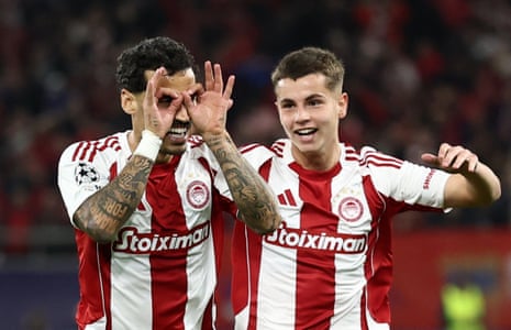 Olympiacos' Chiquinho (left) celebrates scoring their first goal with Christos Mouzakitis.