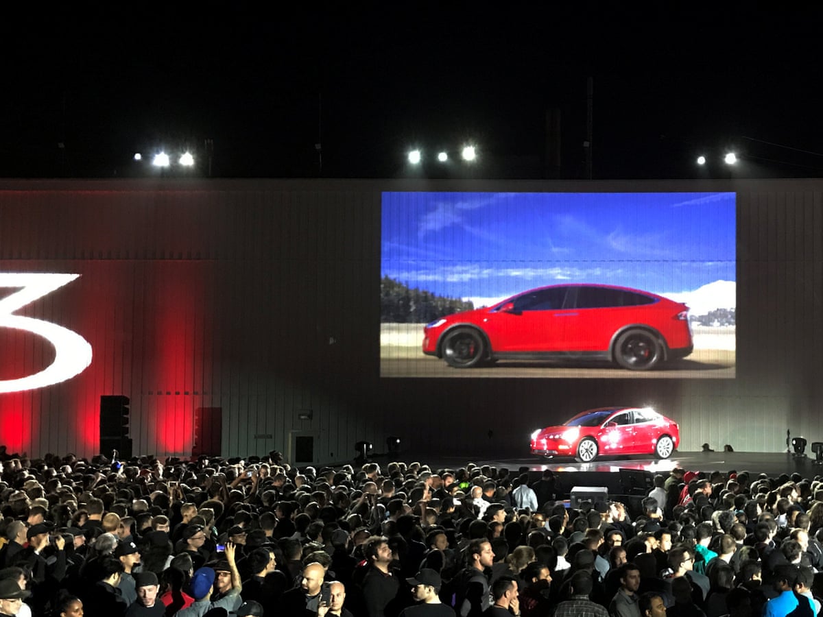 Elon Musk Hands Over First Tesla Model 3 Electric Cars To Buyers Tesla The Guardian Elon Musk Hands Over First Tesla Model 3 Electric Cars To Buyers Tesla The Guardian