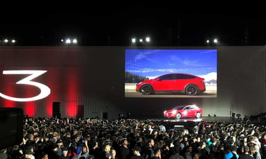 Tesla introduces one of the first Model 3 cars off the Fremont factory’s production line on Friday night.