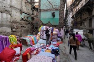 Bedding salesman takes over space left by a collapsed building in Kathmandu