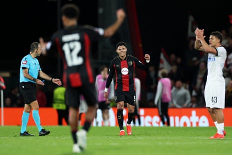 Evanilson smiles while clenching his fist, celebrating a goal for Bournemouth on the pitch